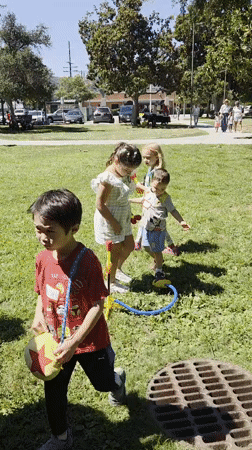 Sunny park afternoon in Glendale with kids and a merch pop-up