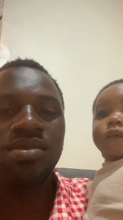 Father and baby share quiet afternoon moments in Jos home