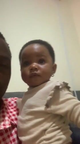 Father and baby share quiet afternoon moments in Jos home