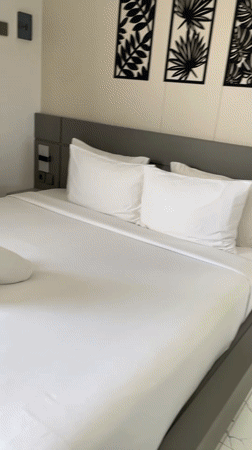 Minimalist hotel room with jungle balcony views in Penebel, Bali