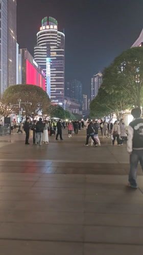 Nighttime commercial district activity documented across Chongqing area