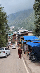 Daily life unfolds on Bhagsu streets near temple