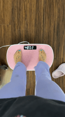 Person exercises on vibration plate in Seal Beach