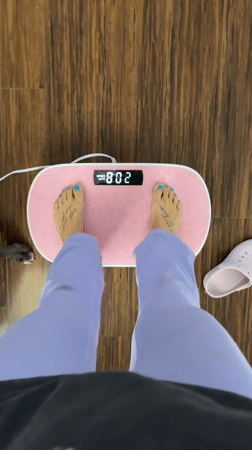 Person exercises on vibration plate in Seal Beach