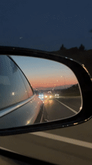 Evening drive through Kazan captured in side mirror reflection