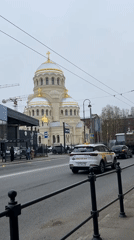 Caravan parked near Orthodox church in Saint Petersburg