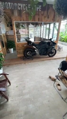 Chained motorcycle parked at Vietnam motorcycle cafe