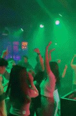 Nightclub scene with dancing and bar atmosphere in Medan