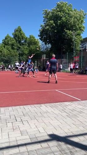 Basketball game underway in Tiraspol, Moldova with spectators