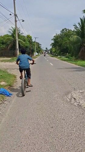 Morning life captured across Indonesian towns: cycling, markets, coffee