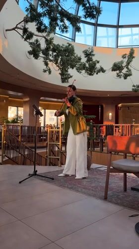 Dinner and live violin at a glass-domed restaurant in Izhevsk