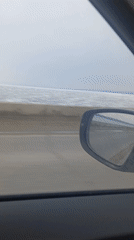 Car journey filmed along waterside road in Chaykovsky