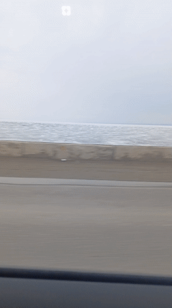Car journey filmed along waterside road in Chaykovsky