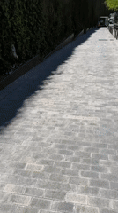 Skateboarder spotted on Barcelona's brick walkways near colorful street mural