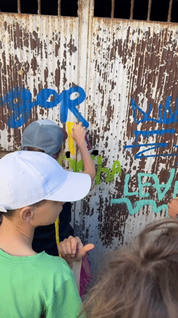 Children paint over graffiti, explore nature in Bar Montenegro