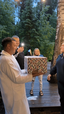 Family celebrates with gifts and dart games in Bakhtiyary