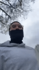 Masked individual spotted outdoors in Los Angeles residential area