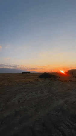 Dusk over a vast steppe landscape near Ақши, Kazakhstan