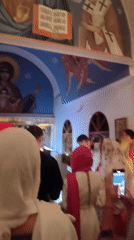 Visitors gather, take photos in Orthodox church