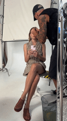 Studio moment in Tel Aviv with a pink phone in hand