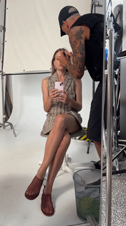 Studio moment in Tel Aviv with a pink phone in hand