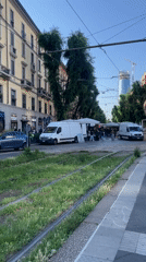 Milan street scene shows overgrown tram tracks