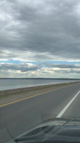 Rolling past a vast river on the roads of Chaikovsky