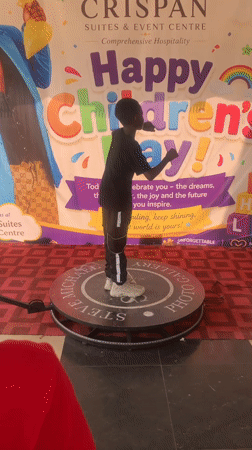 Children celebrate at photo booth during Children's Day event