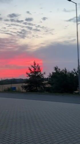 Warehouse shift ends under a vivid Czech summer sunset