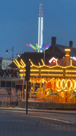 Sunset traffic and fairground lights captured in Great Yarmouth