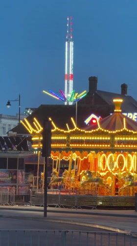Sunset traffic and fairground lights captured in Great Yarmouth