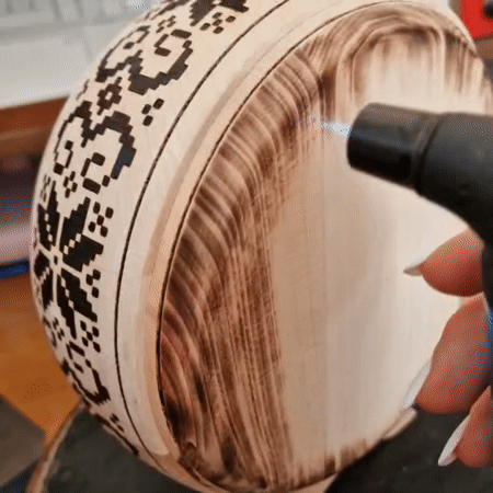 Geometric patterns burned into wood by hand