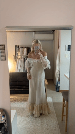 Woman Takes Mirror Selfie in Off-White Dress in Seoul