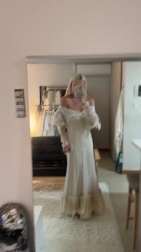 Woman Takes Mirror Selfie in Off-White Dress in Seoul