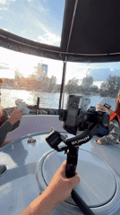 Mother and child enjoy afternoon boat trip on Kazanka River