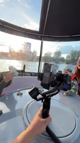 Mother and child enjoy afternoon boat trip on Kazanka River