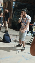 Late-night street performance in Rome, graffiti walls and all