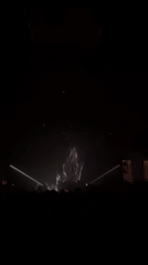 DJ performs at New York nightclub with dramatic lighting