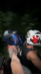 Two motorcyclists captured on camera during night ride in Kuta