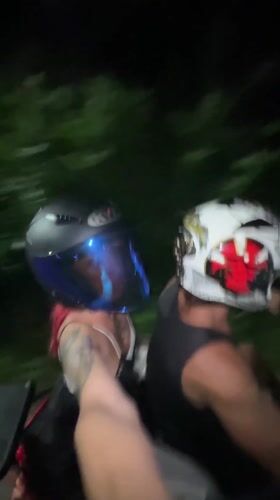 Two motorcyclists captured on camera during night ride in Kuta