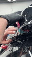 Auto detailing shop busy with protective film applications in Krasnoyarsk