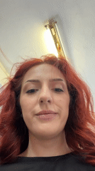 Woman photographed smiling at camera in Bulgarian town