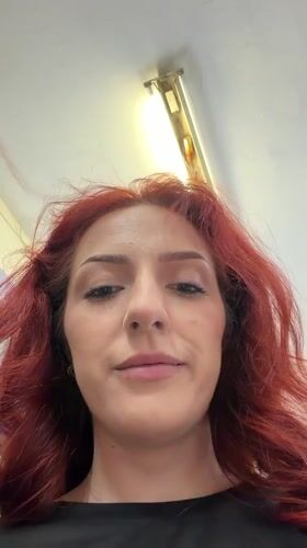 Woman photographed smiling at camera in Bulgarian town