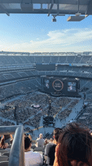 Packed stadium concert in East Rutherford with interactive song requests