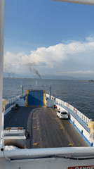 Ferry sails calm waters near Keramoti, Greece