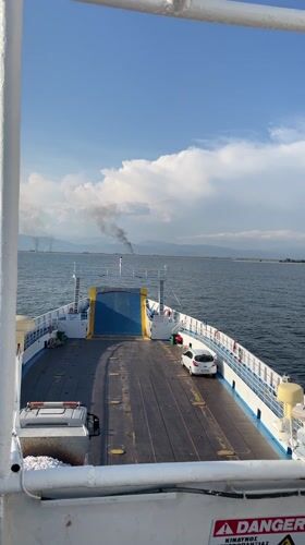 Ferry sails calm waters near Keramoti, Greece