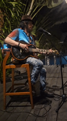 Live electric guitar set at a tropical outdoor venue in Bali