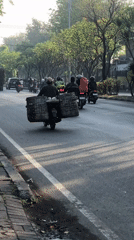 Morning traffic moves through Gelam's busy main road