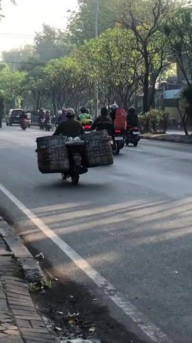 Morning traffic moves through Gelam's busy main road
