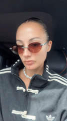Woman in Adidas tracksuit films selfie in car, Wichit Thailand